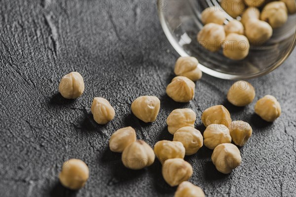 Close up hazelnuts near glass