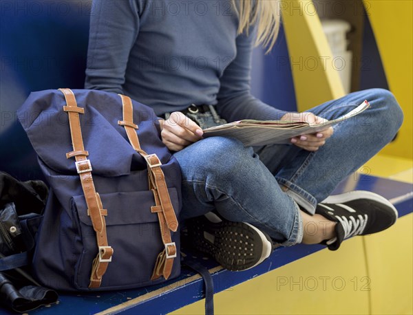 Close up woman reading map