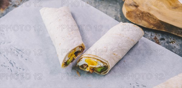 Close up wrap tacos with butter paper