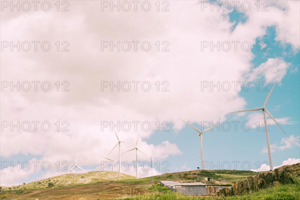 Cloudy sky rural with windmills