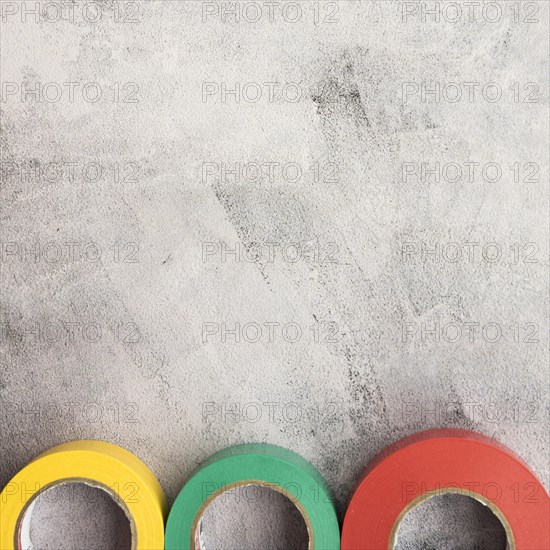 Colorful insulating tape row concrete backdrop