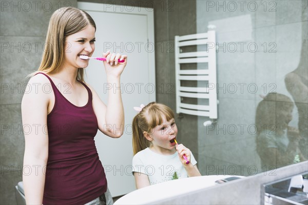 Cute woman girl brushing teeth