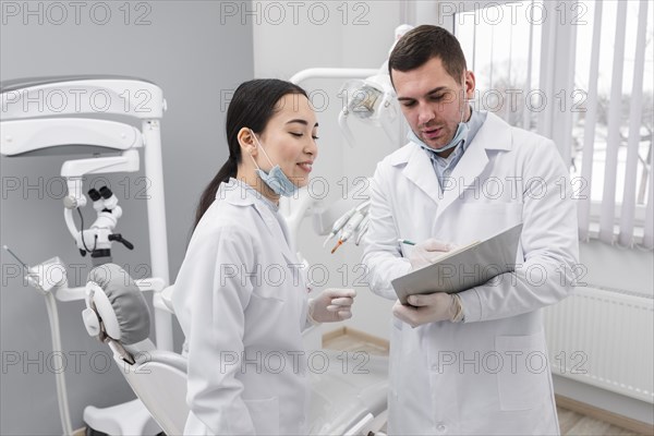 Dentists looking clipboard