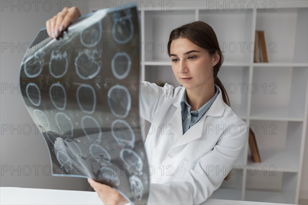 Doctor checking patients x ray