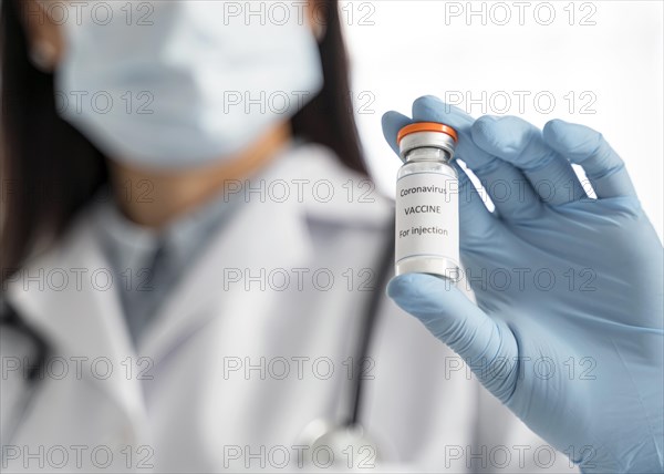 Doctor holding coronavirus vaccine recipient her hand