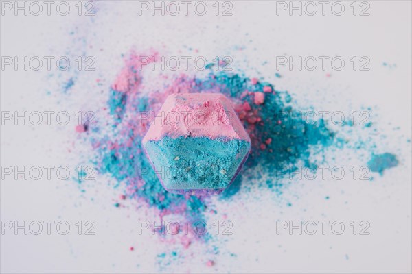 Elevated view pink blue colored bath bomb white background