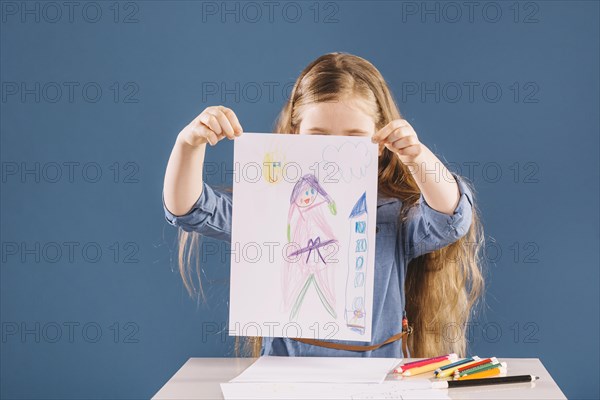 Faceless girl showing picture
