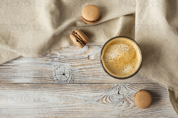 Flat lay cup coffee macarons