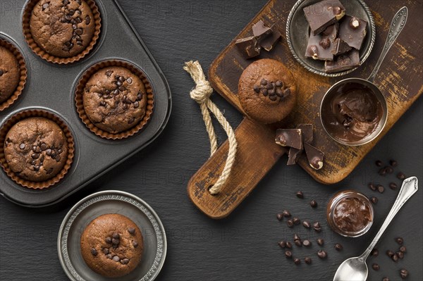 Flat lay tasty muffin with chocolate chocolate chips