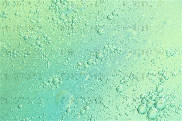 Green airy water bubbles glowing drops