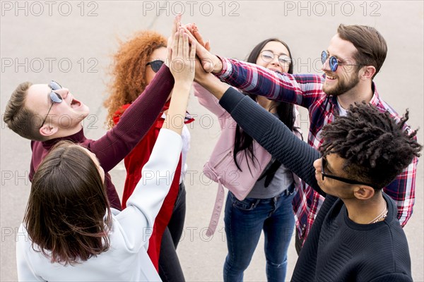 Group multiethnic friends giving high street