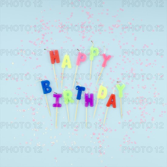 Happy birthday candles glitter blue background