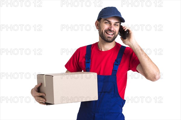 Hard worker courier man holding box talking phone