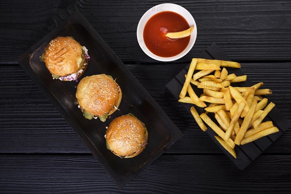 High angle american burgers with fries sauce