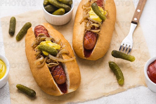 High angle hot dogs with mustard onion