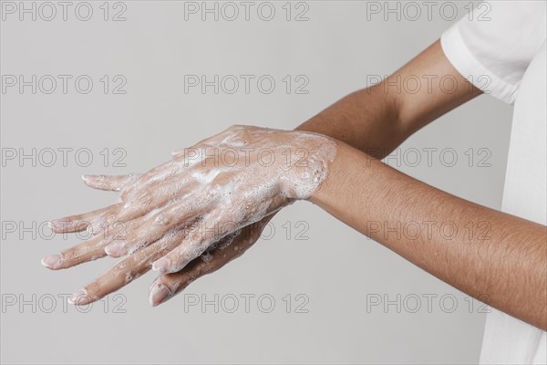 High view hygiene concept washing hands with soap