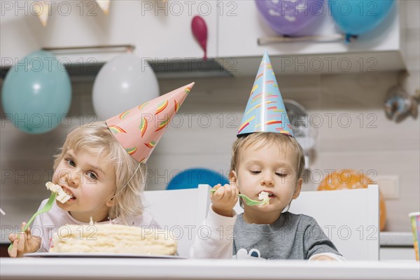 Kids eating cake birthday party