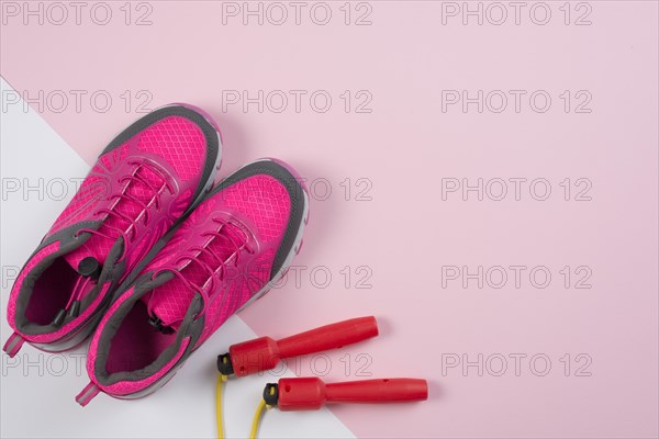 Lovely sport composition with skipping rope trainers