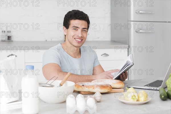 Man learning how cook from online courses