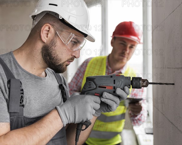 Medium shot man working with drill