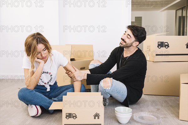 Moving concept with bored couple