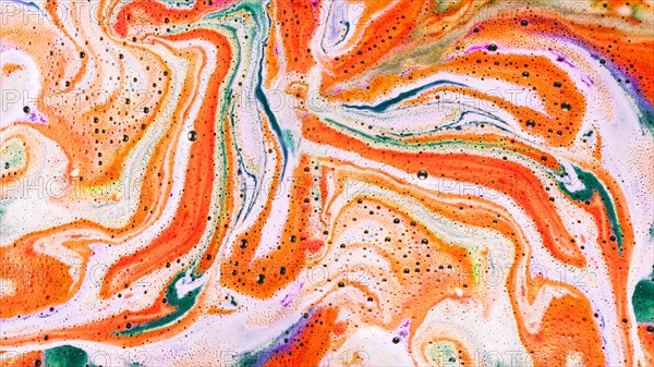 Overhead view color bath bomb foam water