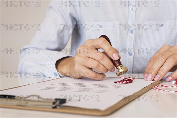 Person using wax seal front view