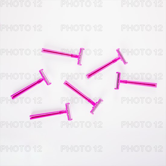Pink female razors white background