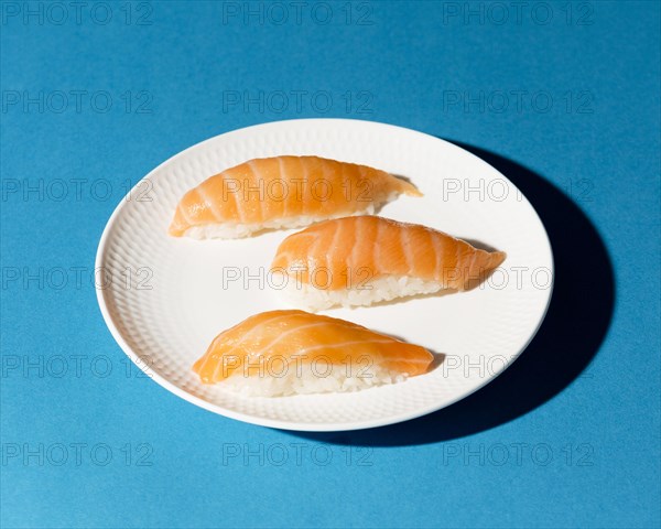 Plate with fresh sushi rolls desk