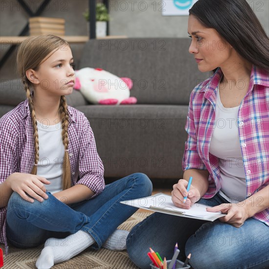 Psychologist having session with her girl patient office