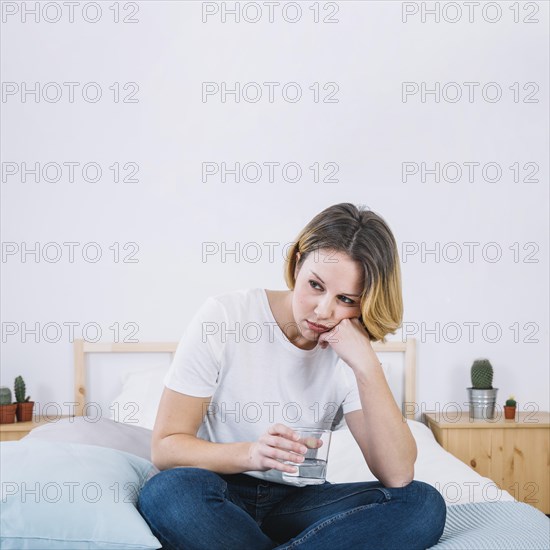 Sad woman with water bed