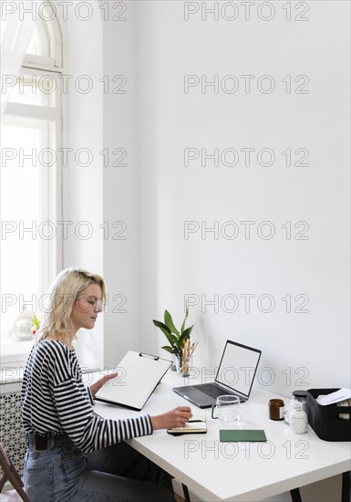 Side view woman working from home