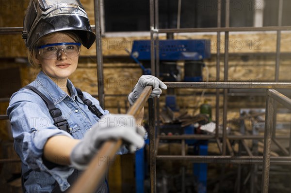 Smiley female welder work