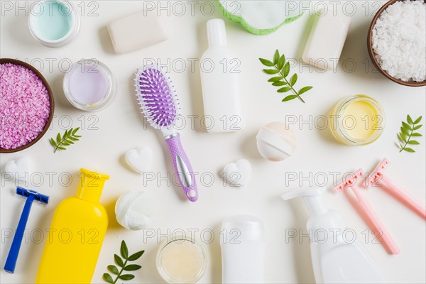 Spa cosmetics products with razor hairbrush white background