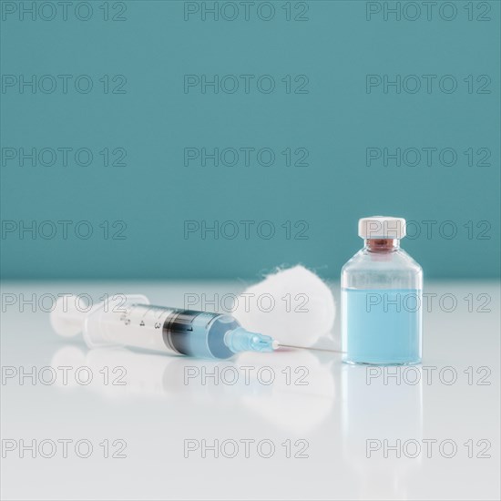 Syringe with cotton vaccine bottle table