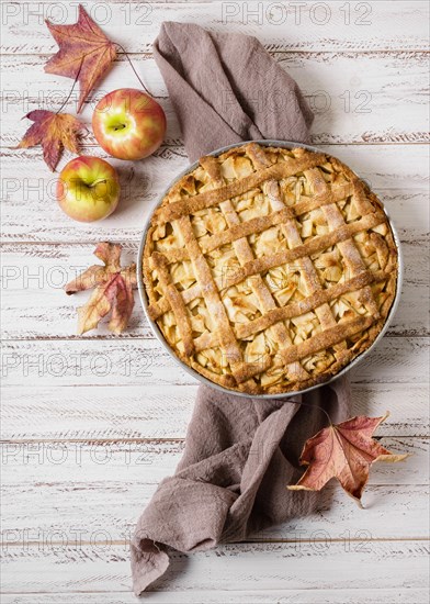 Top view apple pie thanksgiving with autumn leaves