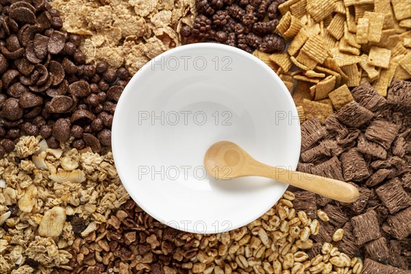 Top view assortment breakfast cereals with empty bowl