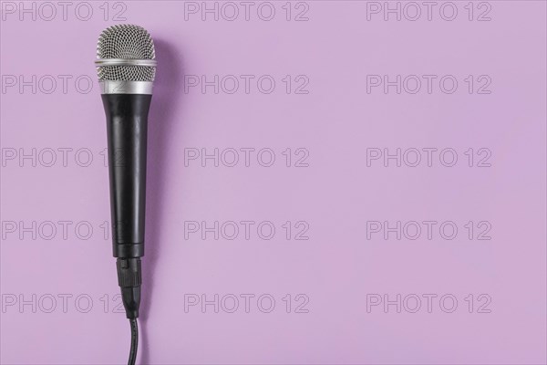Top view microphone pink background