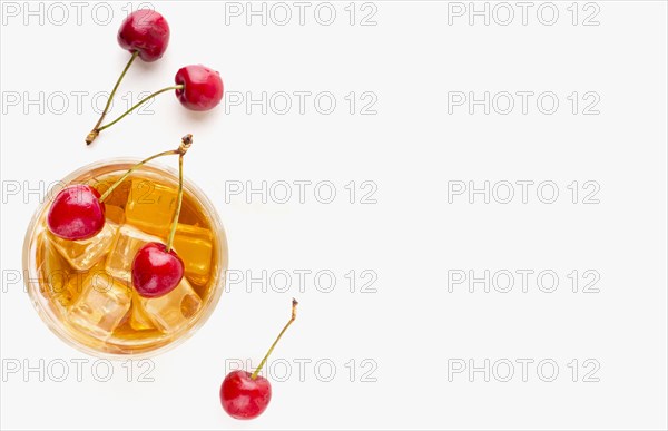 Top view whiskey glass cherries with copy space