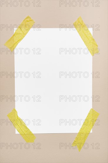 White sheet stick wall with yellow tape