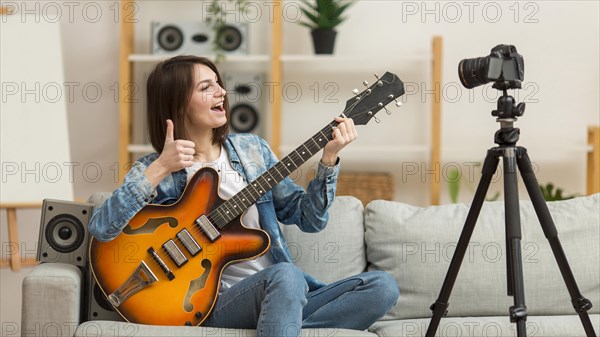 Woman filming music video home