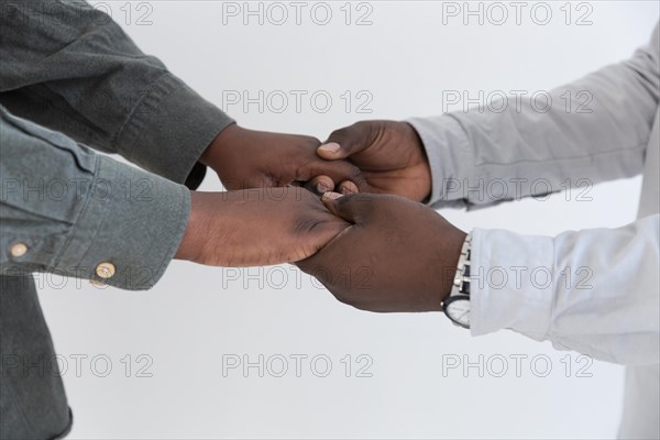 Afro american people hands holding each other