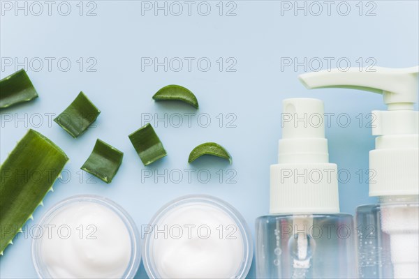 Aloe vera natural spray bottle cream beauty blue background