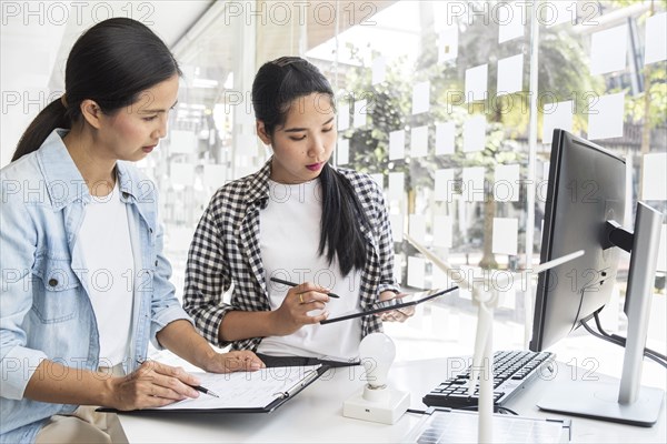 Asian women working together innovation