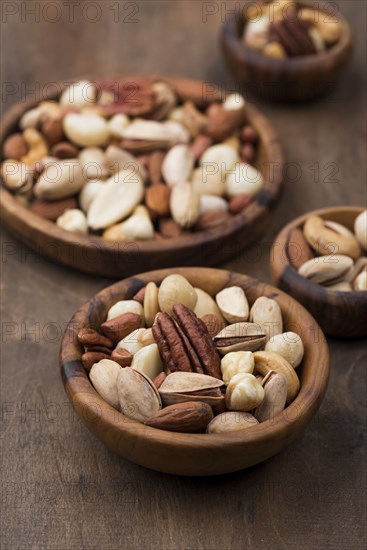 Assorted bowls delicious nuts snack high view