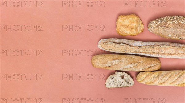 Baguette bread loaf puff pastry buns colored background