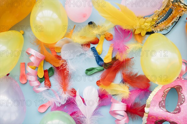 Balloons near masks feathers