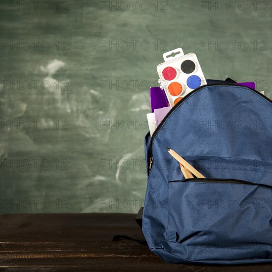 Blue backpack with stationery watercolors