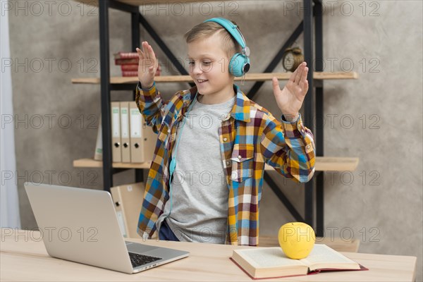 Boy listening music laptop