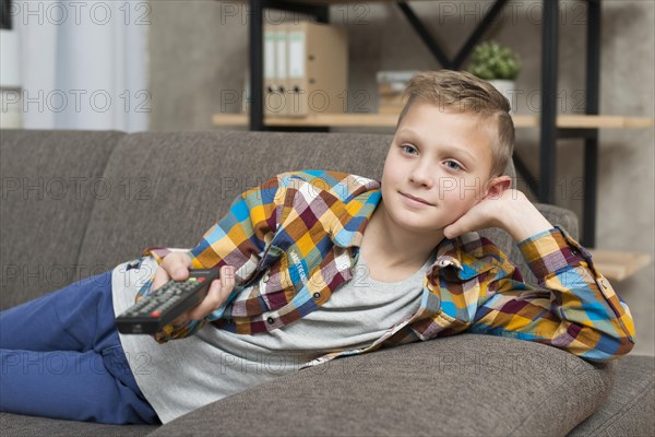 Boy watching tv couch